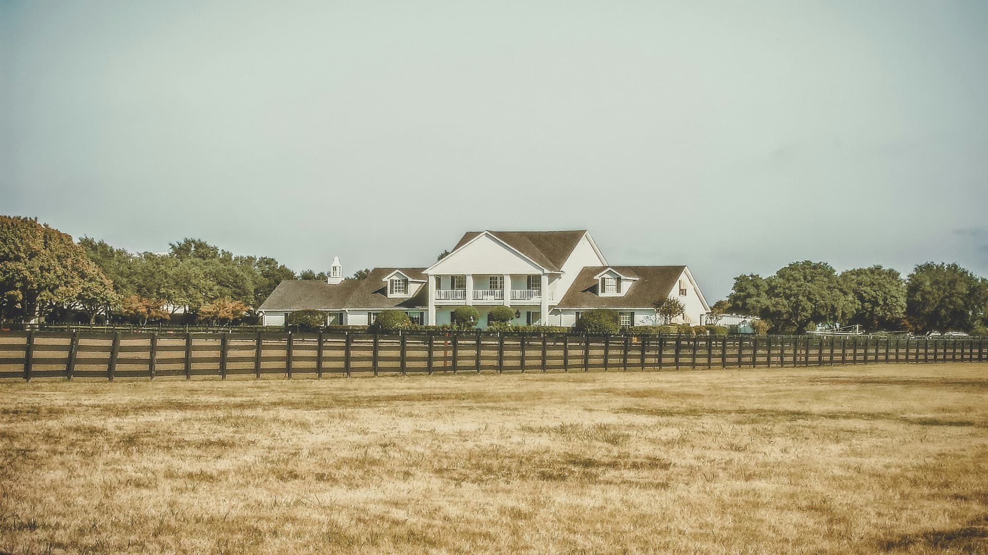 A classic two-story home in Texas, representing the stability of homeownership.