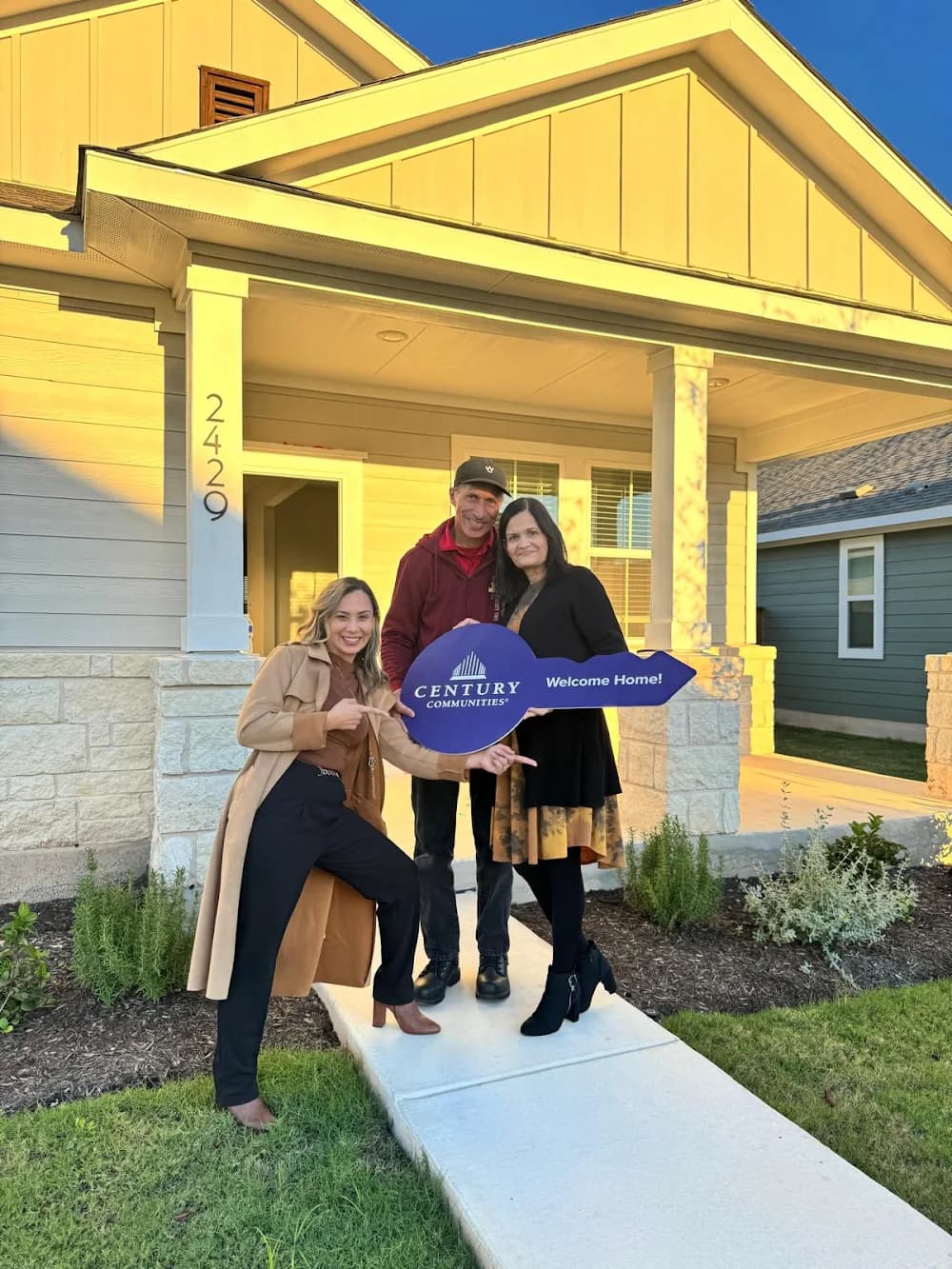 Family on their home closing day with Sully Ruiz